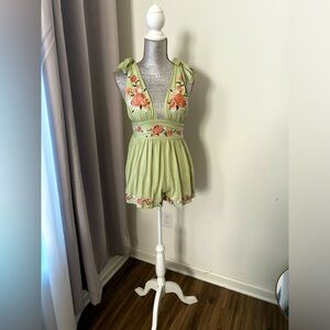 Mint green embroidered romper that ties at shoulder. Brand new